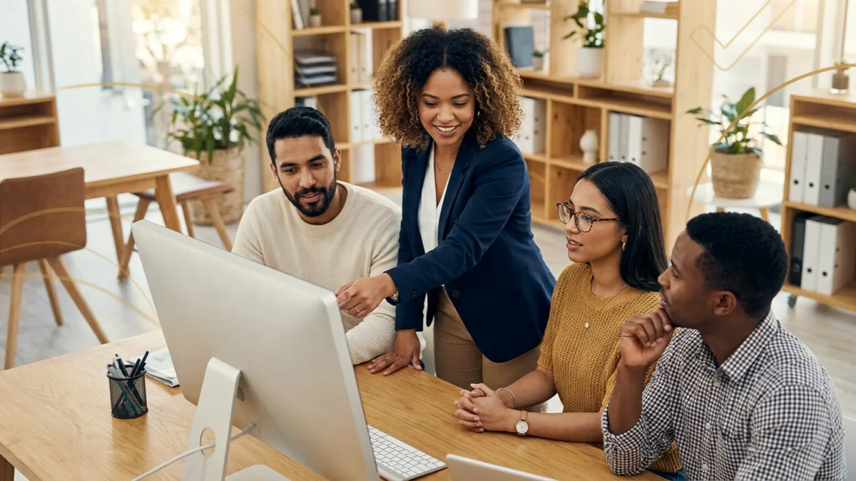 Small business team learning to use AI tools through a practical 30-day employee training plan